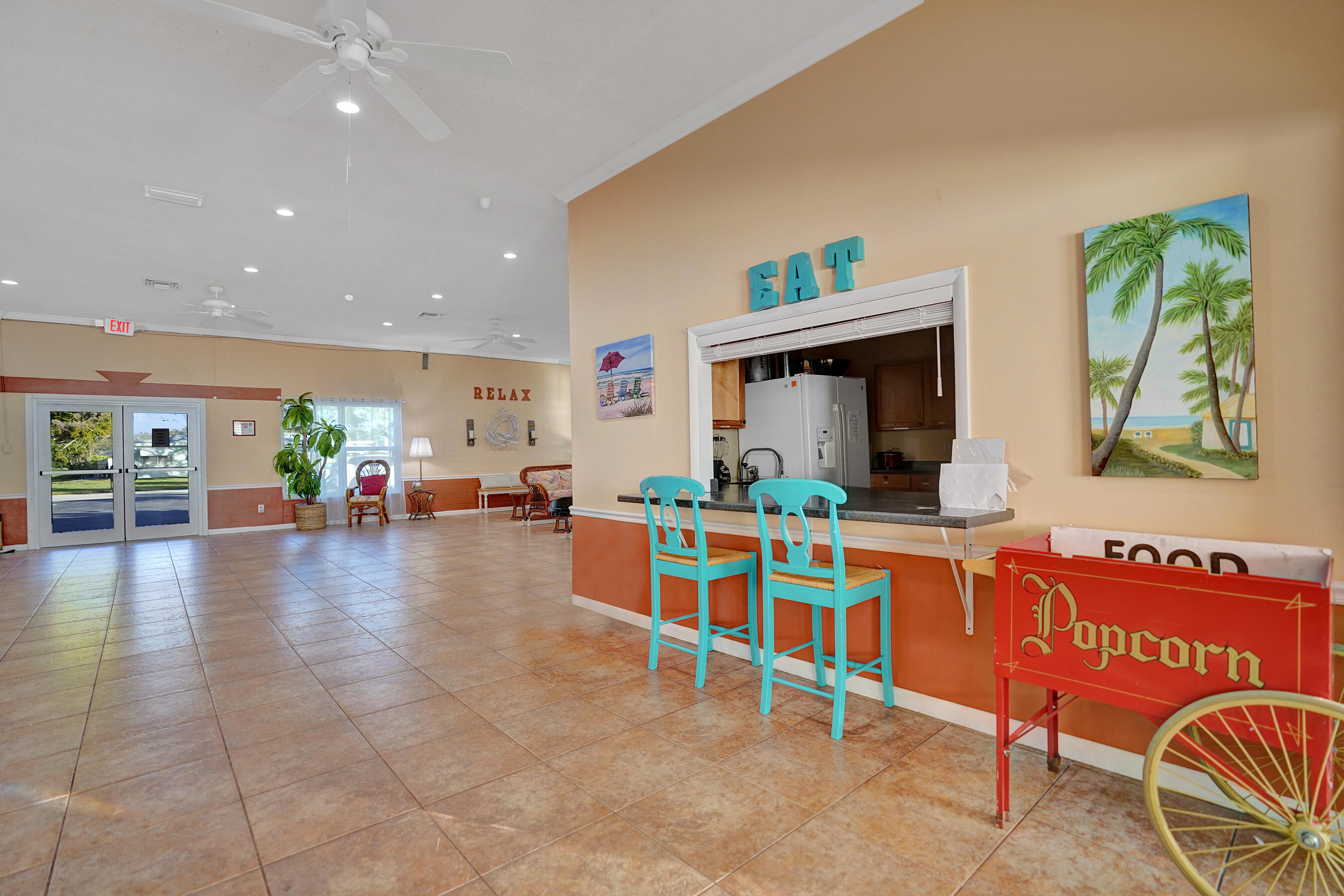 515 High Point Drive, Unit A Delray Beach, FL 33445 - Photo 58 of 60 a dining hall with furniture and a view of kitchen
