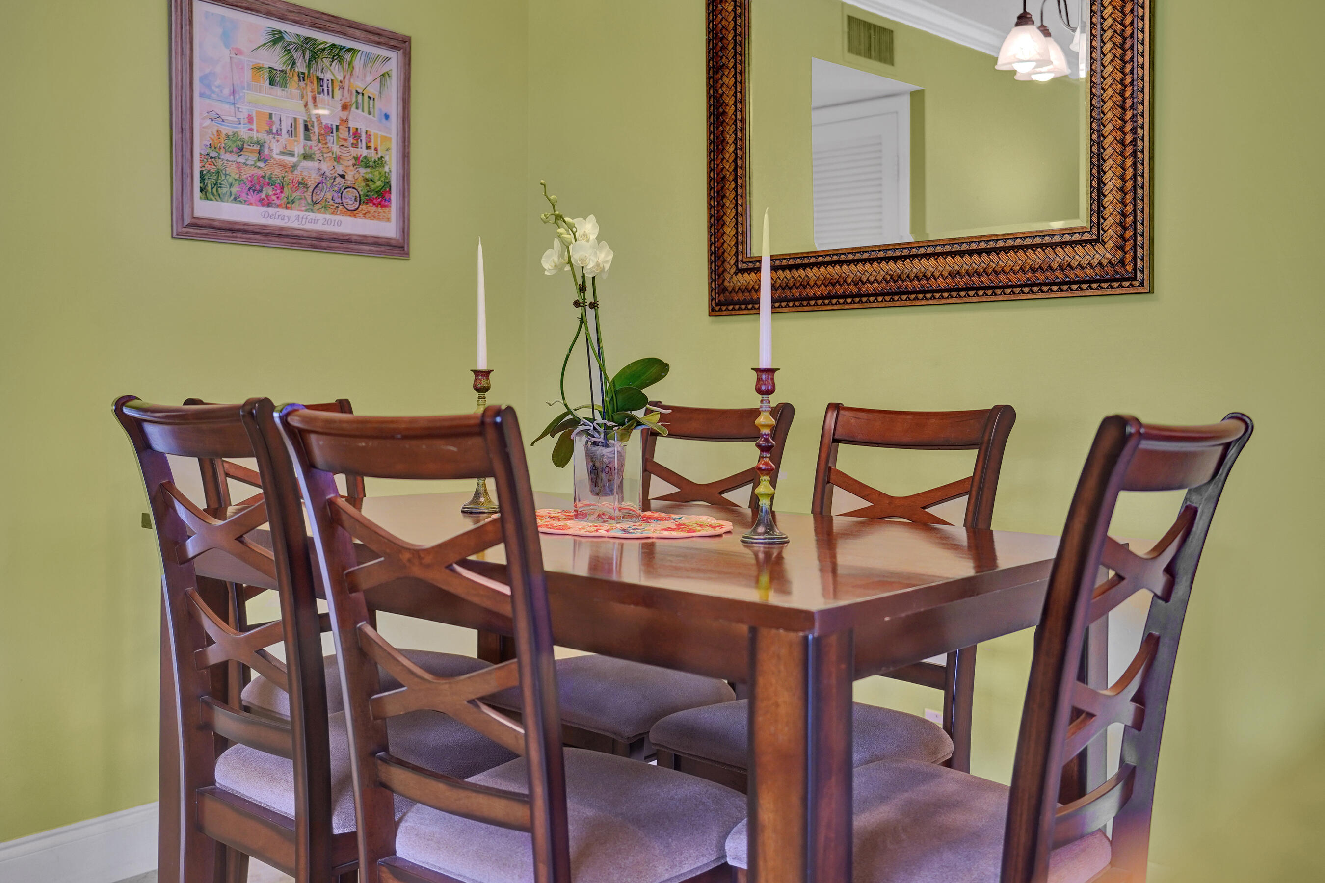515 High Point Drive, Unit A Delray Beach, FL 33445 - Photo 10 of 60 a view of a dining room with furniture and a potted plant