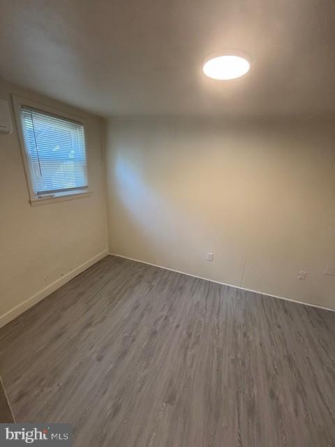 90 South Main Street Dover, PA 17315 - Photo 4 of 8 an empty room with wooden floor and windows