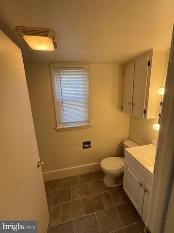 a bathroom with a toilet and a sink