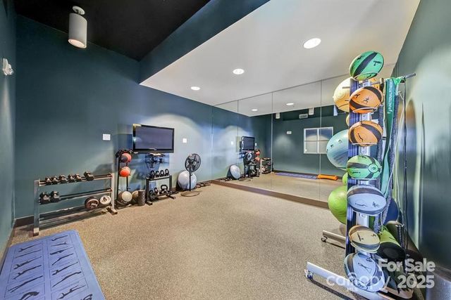 a room with gym equipment and a window