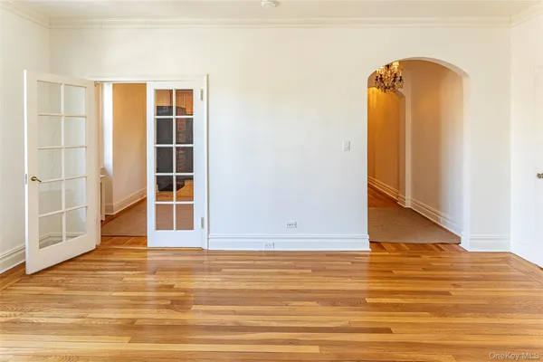 a view of a room with wooden floor and windows