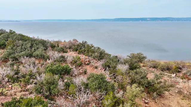 an aerial view of a house with mountain view