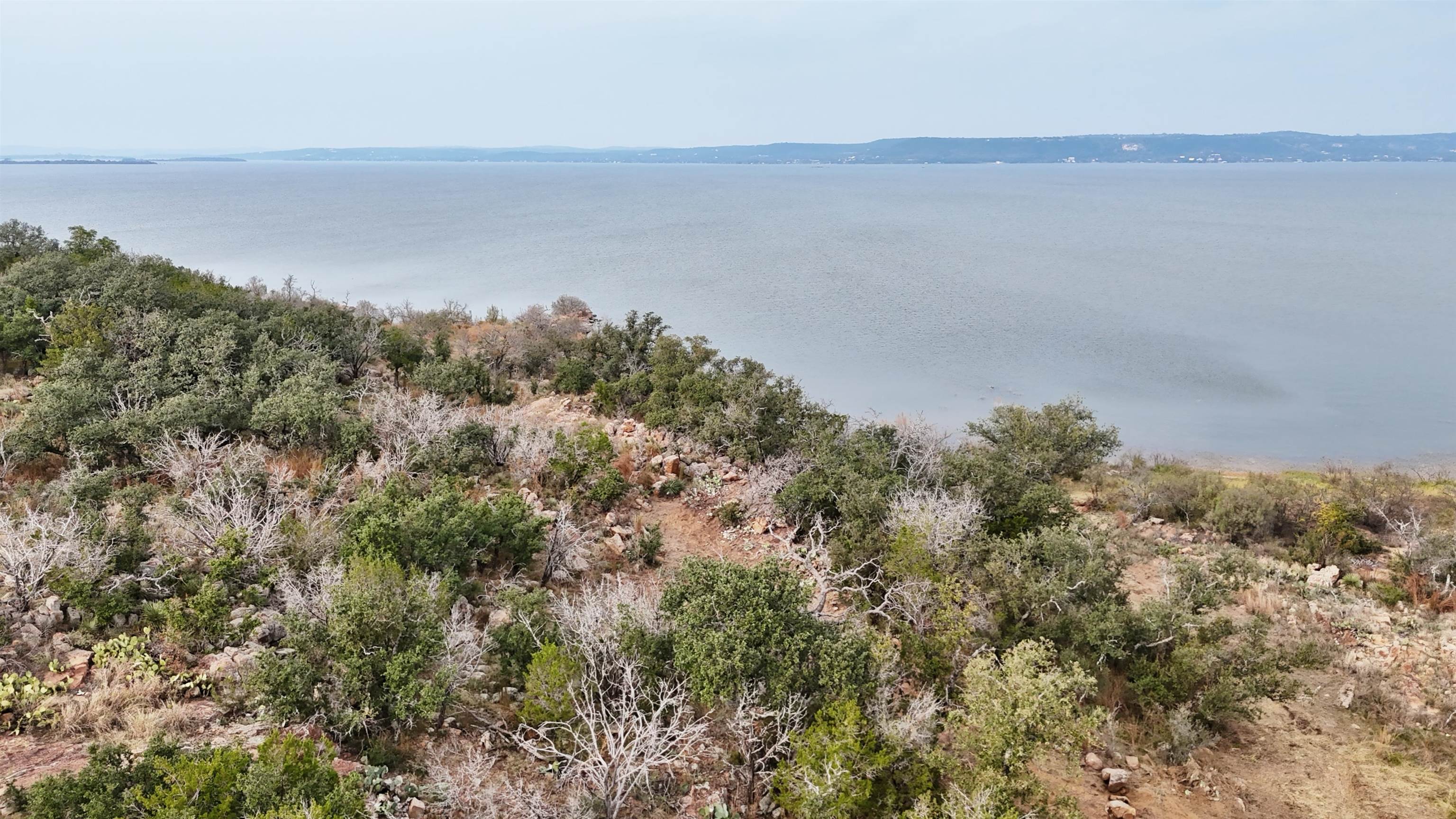 Tbd Peninsula Drive Burnet, TX 78611 - Photo 3 of 18 a view of a lake with mountain in the background