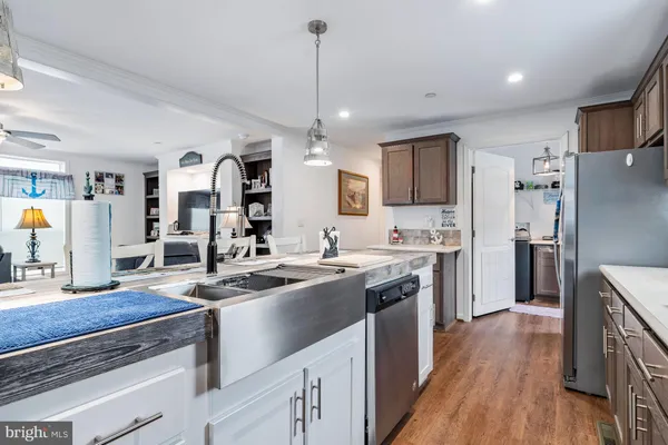 a kitchen with a sink stove and refrigerator