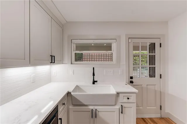 a kitchen with a sink and a window