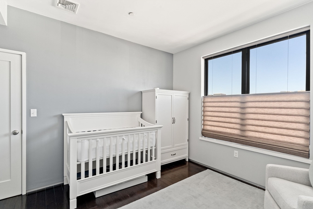 345 D Street, Unit 11 Boston, MA 02127 - Photo 16 of 23 a view of a bedroom with furniture and windows