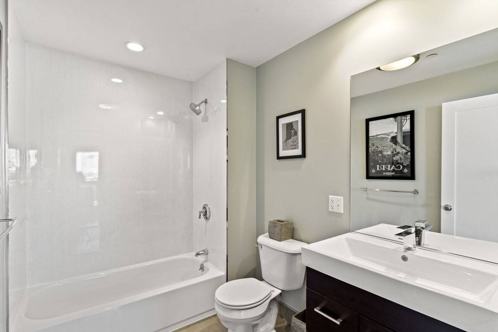 345 D Street, Unit 11 Boston, MA 02127 - Photo 18 of 23 a bathroom with a sink a toilet and shower