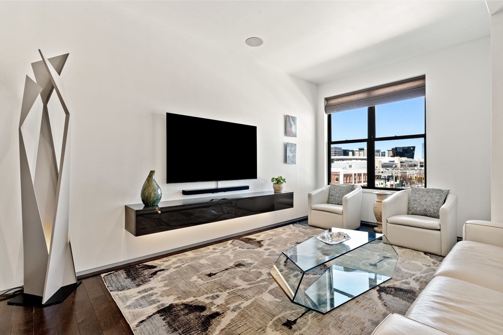 345 D Street, Unit 11 Boston, MA 02127 - Photo 6 of 23 a living room with furniture and a flat screen tv