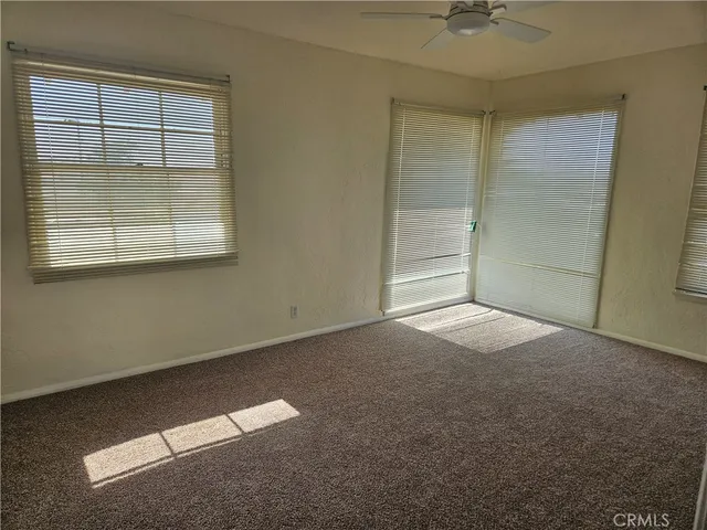 an empty room with a empty space and a window