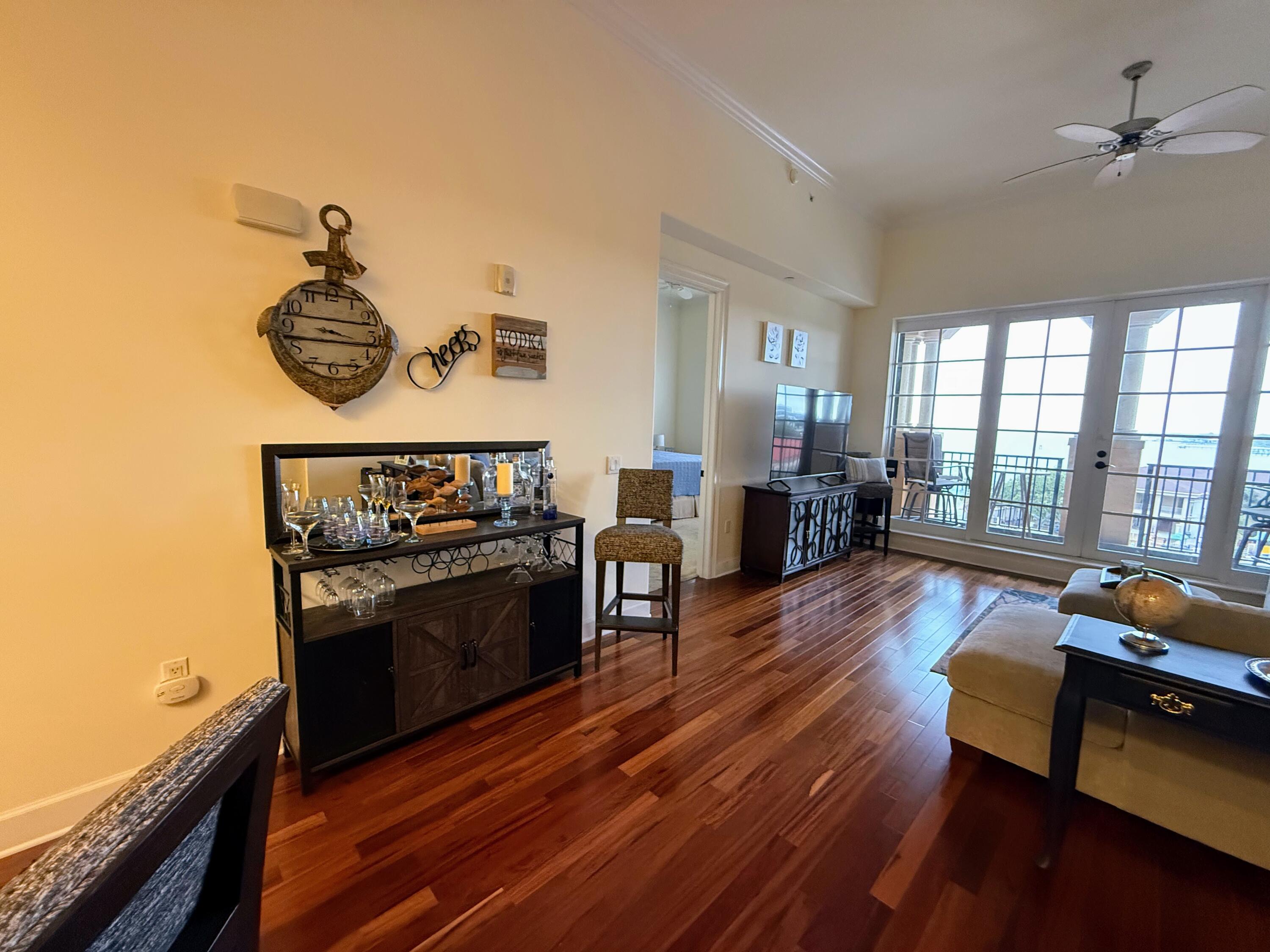 20 Orange Avenue, Unit 9 Fort Pierce, FL 34950 - Photo 53 of 92 a living room with furniture and wooden floor