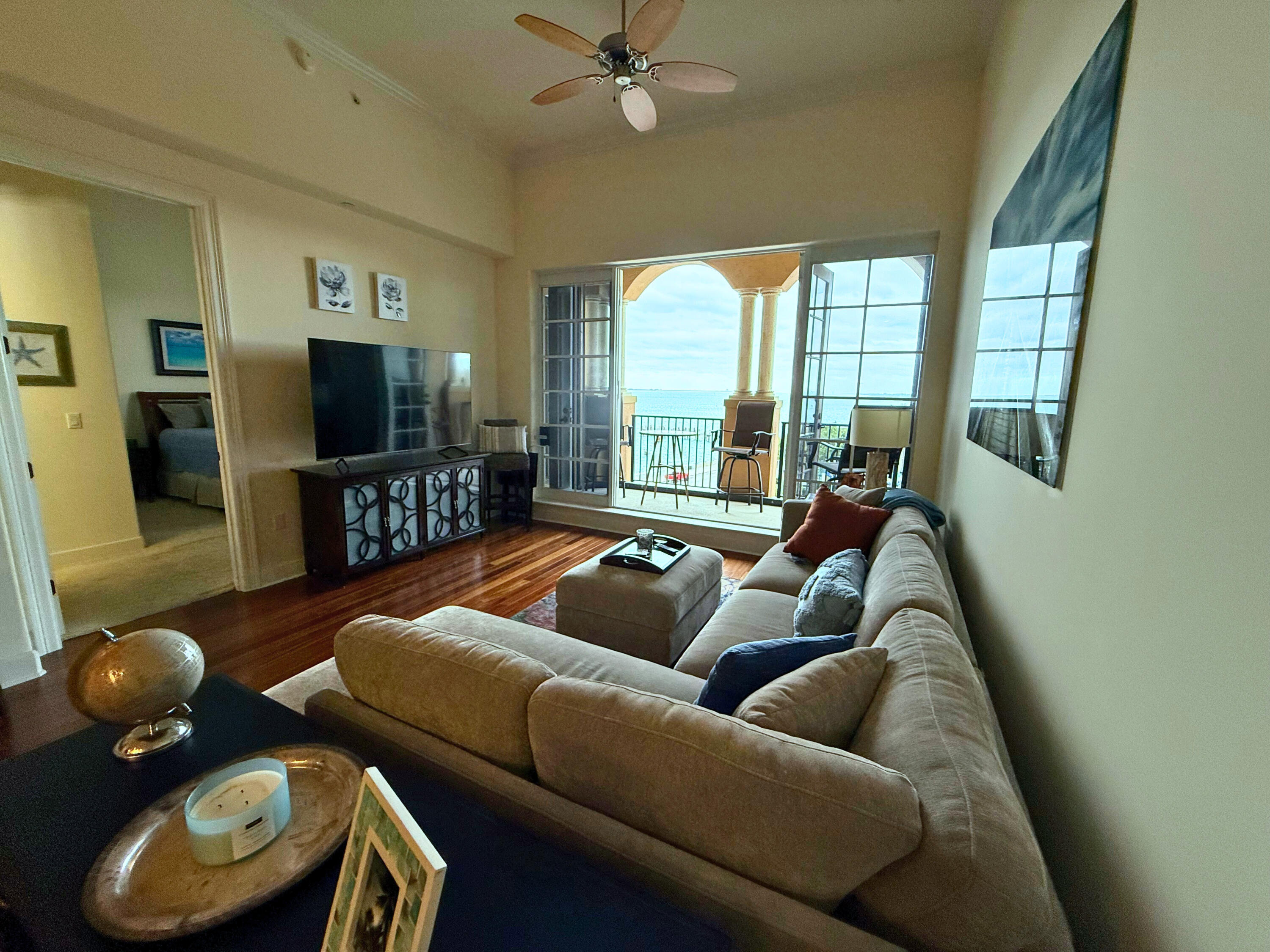 20 Orange Avenue, Unit 9 Fort Pierce, FL 34950 - Photo 62 of 92 a living room with furniture and a flat screen tv