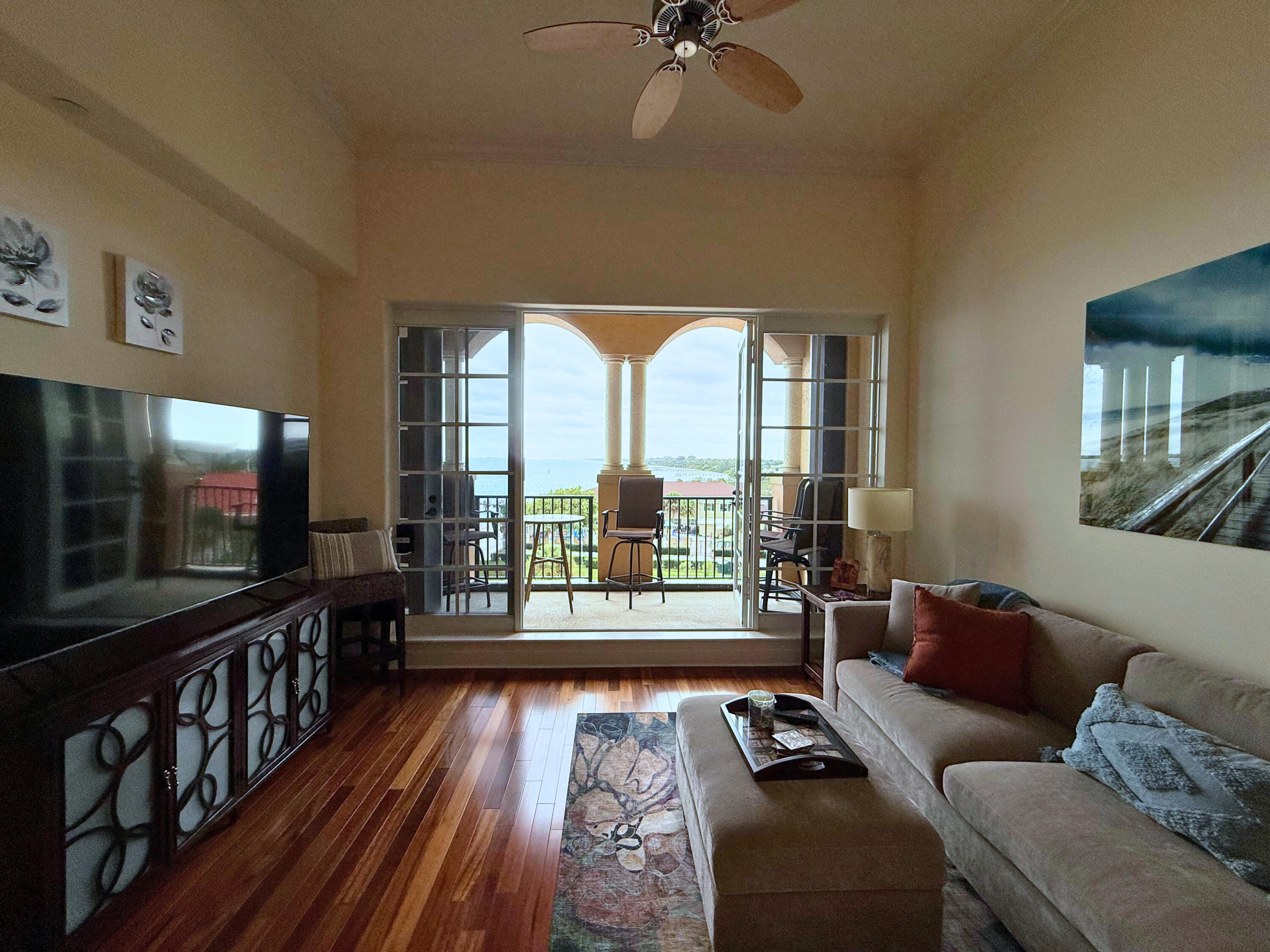 20 Orange Avenue, Unit 9 Fort Pierce, FL 34950 - Photo 63 of 92 a living room with furniture and a flat screen tv