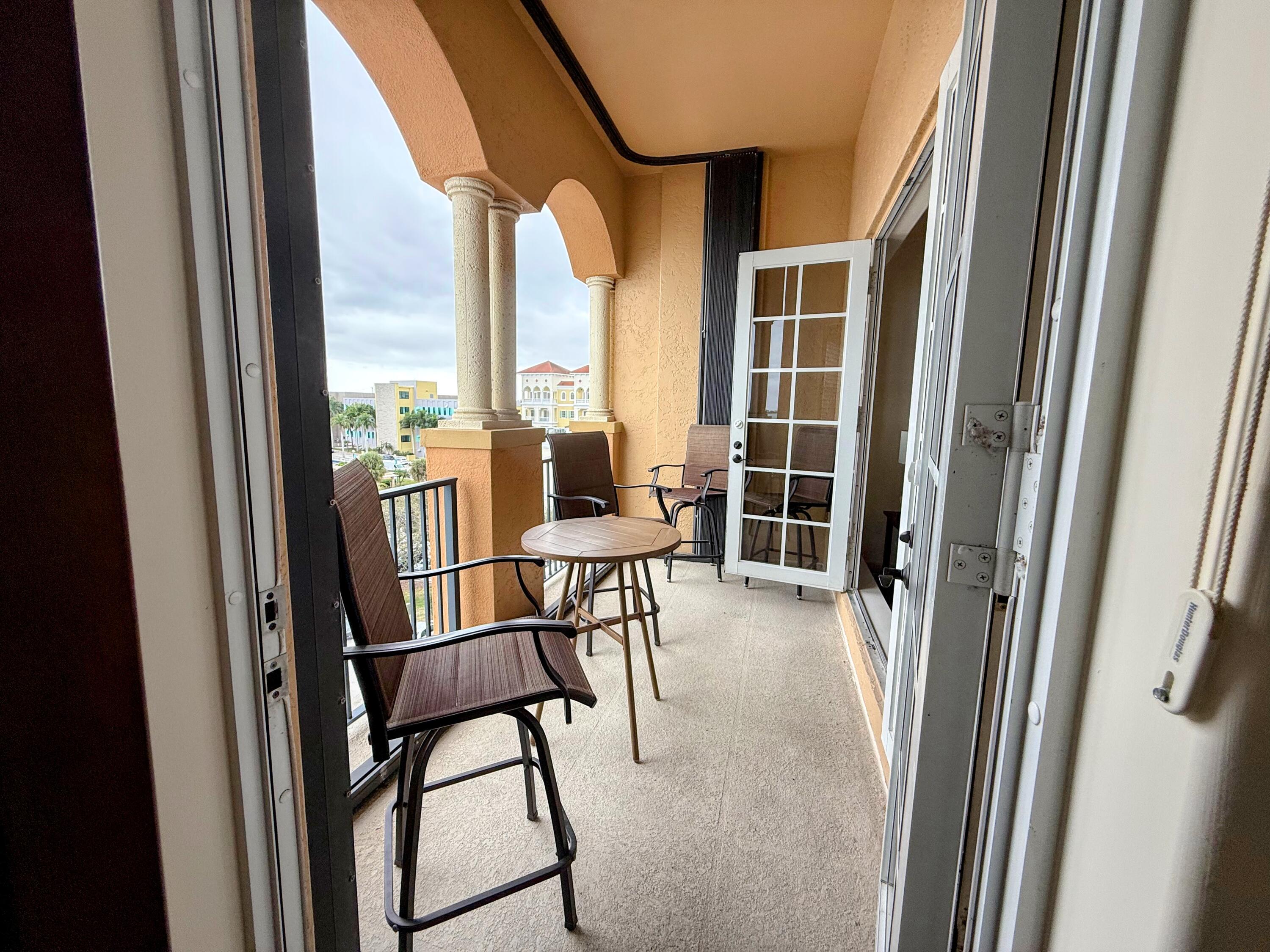 20 Orange Avenue, Unit 9 Fort Pierce, FL 34950 - Photo 69 of 92 a view of a balcony with furniture and next to a window