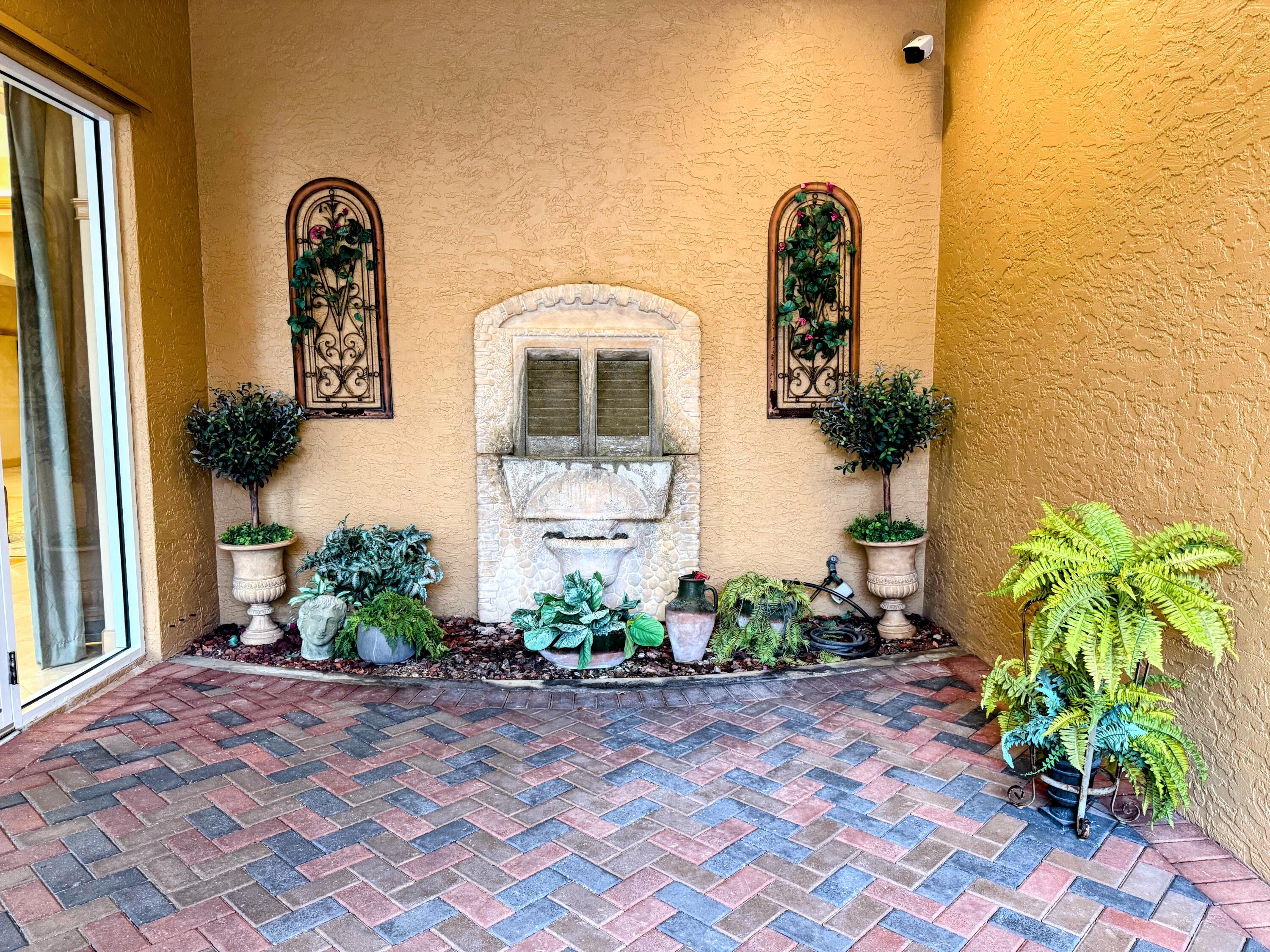 20 Orange Avenue, Unit 9 Fort Pierce, FL 34950 - Photo 8 of 92 a front view of a house with garden