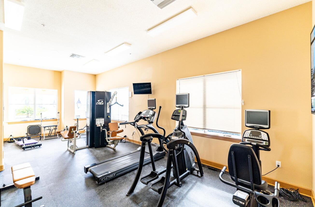 20 Orange Avenue, Unit 9 Fort Pierce, FL 34950 - Photo 87 of 92 a view of a room with gym equipment
