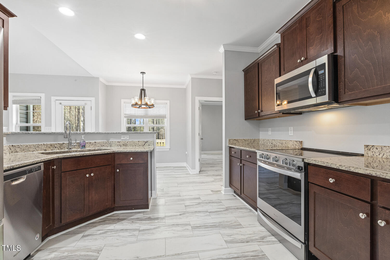 808 Cross Link Drive Angier, NC 27501 - Photo 13 of 30 a kitchen with stainless steel appliances granite countertop a stove microwave and sink
