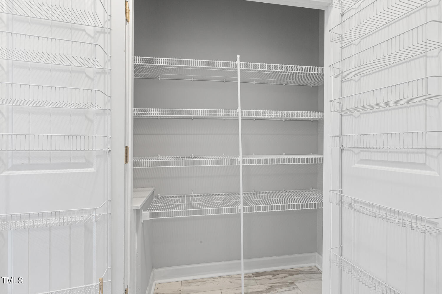 808 Cross Link Drive Angier, NC 27501 - Photo 14 of 30 a view of walk in closet with empty racks
