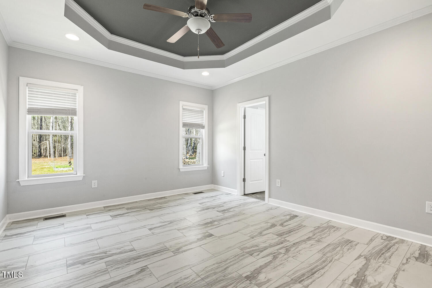 808 Cross Link Drive Angier, NC 27501 - Photo 18 of 30 a view of empty room with wooden floor and fan