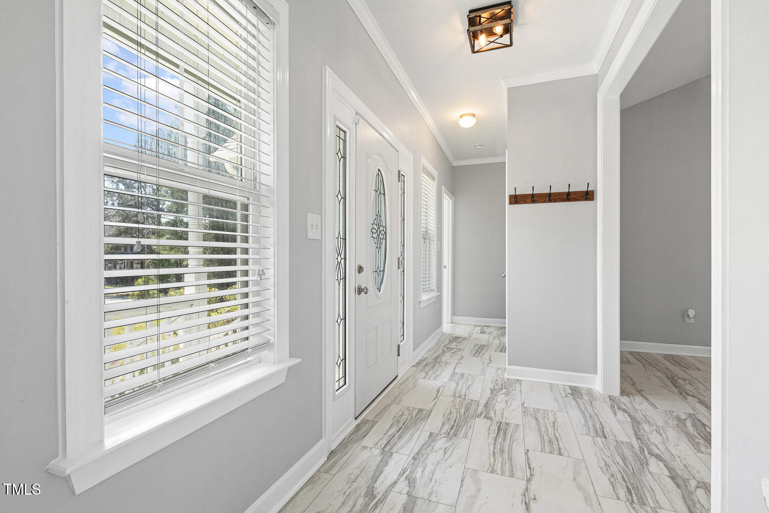 808 Cross Link Drive Angier, NC 27501 - Photo 4 of 30 a view of hallway with windows and wooden floor