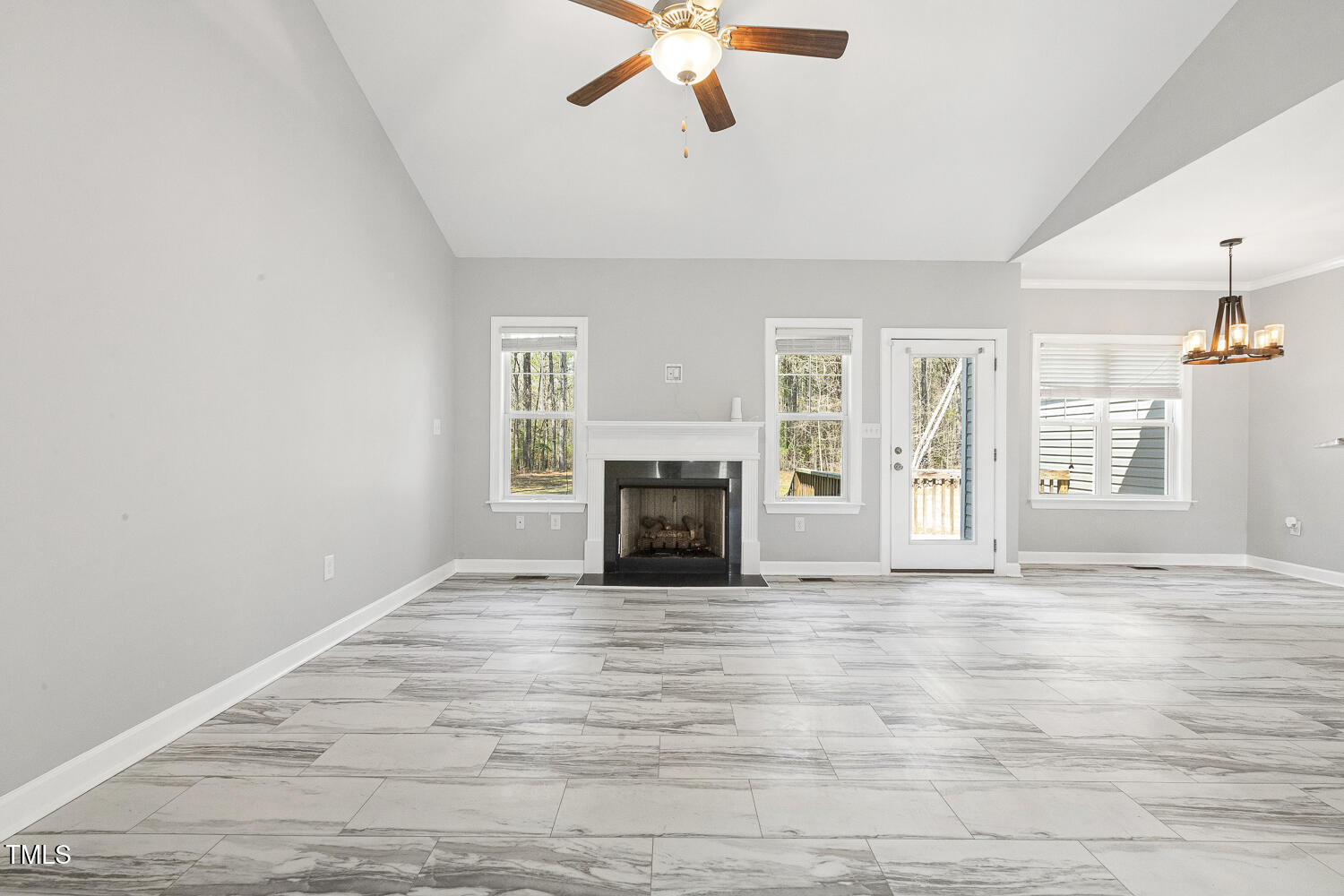 808 Cross Link Drive Angier, NC 27501 - Photo 5 of 30 wooden floor fireplace and windows in an empty room