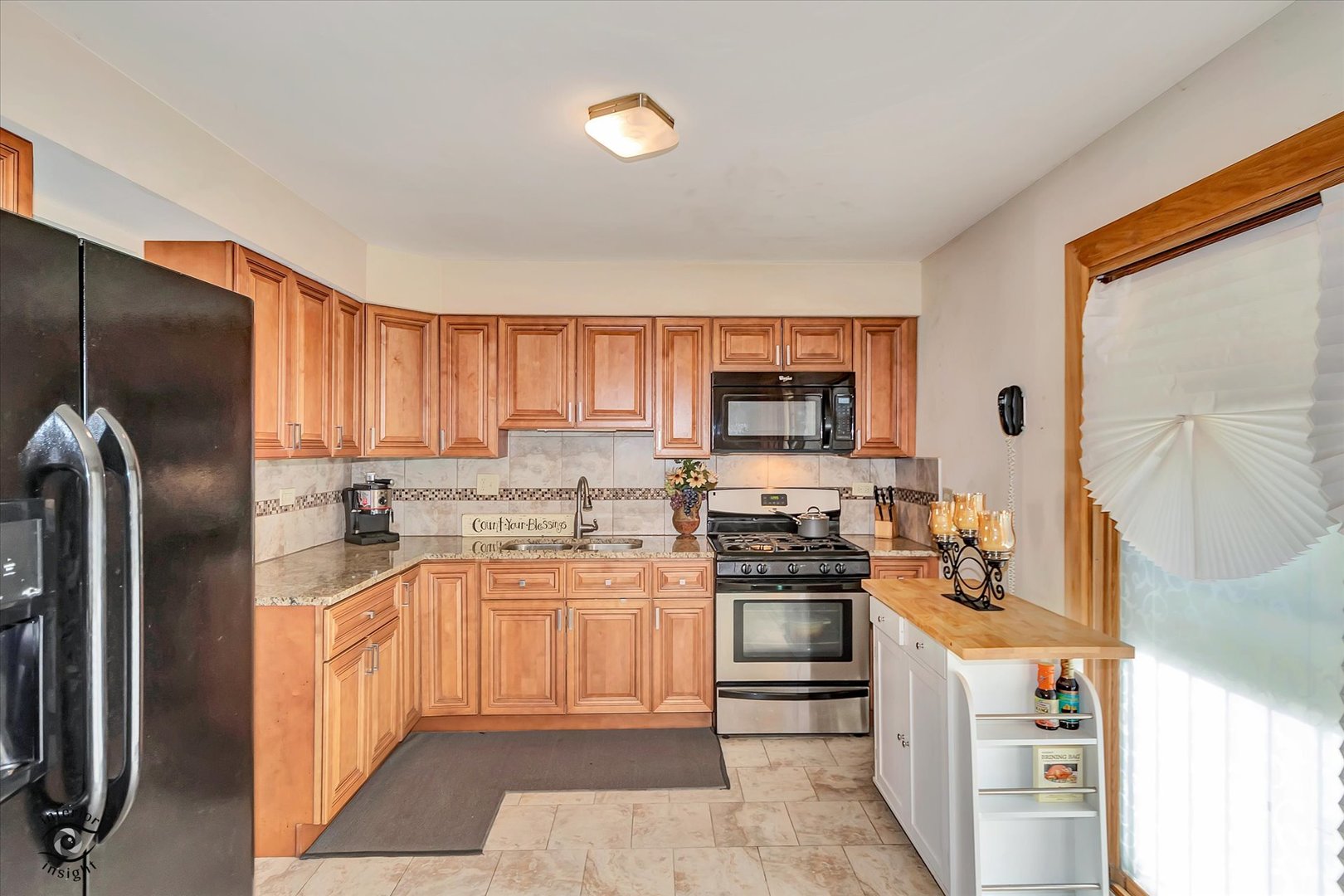 3257 Magnolia Drive Markham, IL 60428 - Photo 10 of 26 a kitchen with stainless steel appliances a stove a sink and a refrigerator