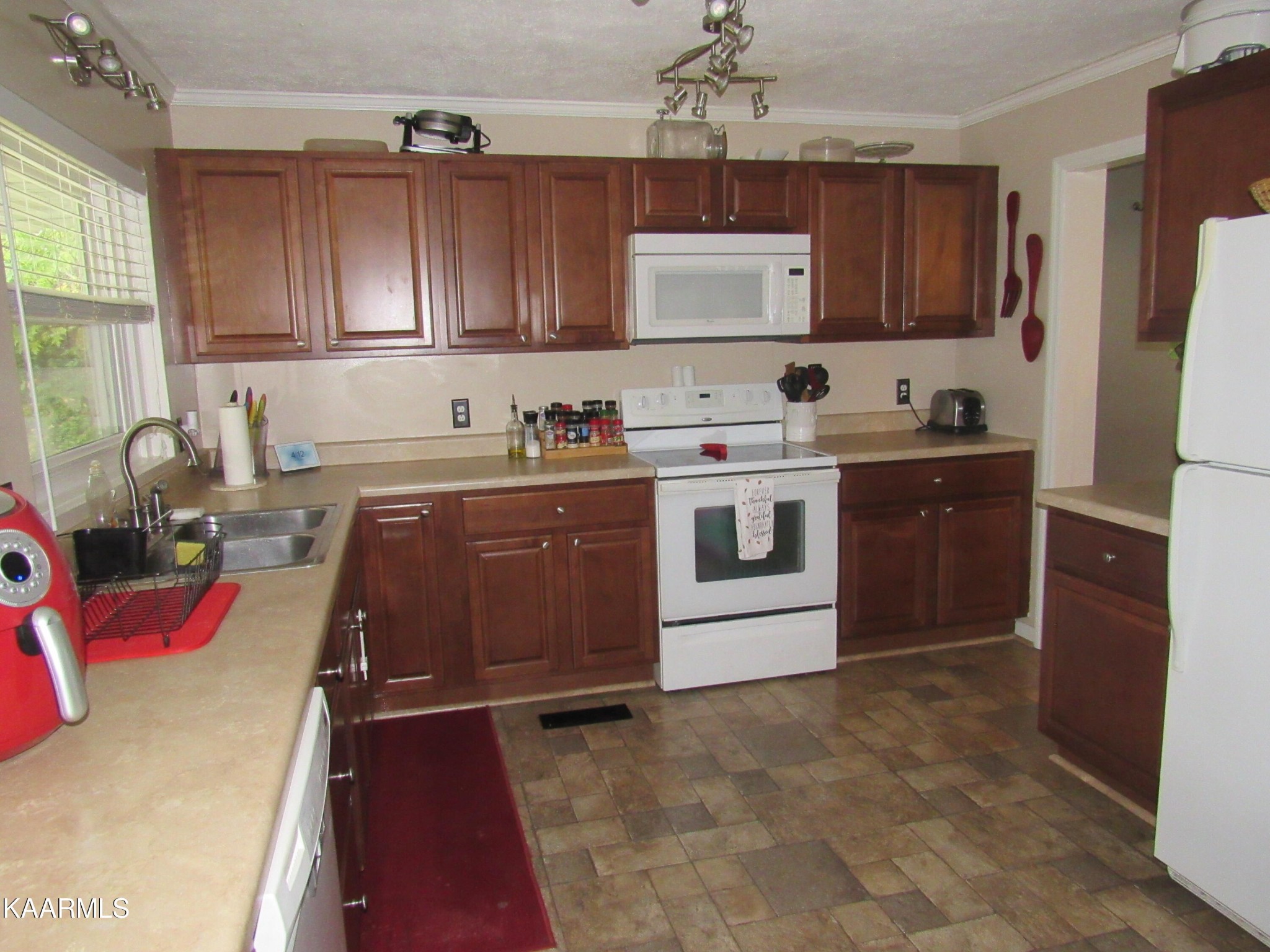 146 Outer Drive Oak Ridge, TN 37830 - Photo 8 of 38 a kitchen with stainless steel appliances granite countertop a sink stove and refrigerator