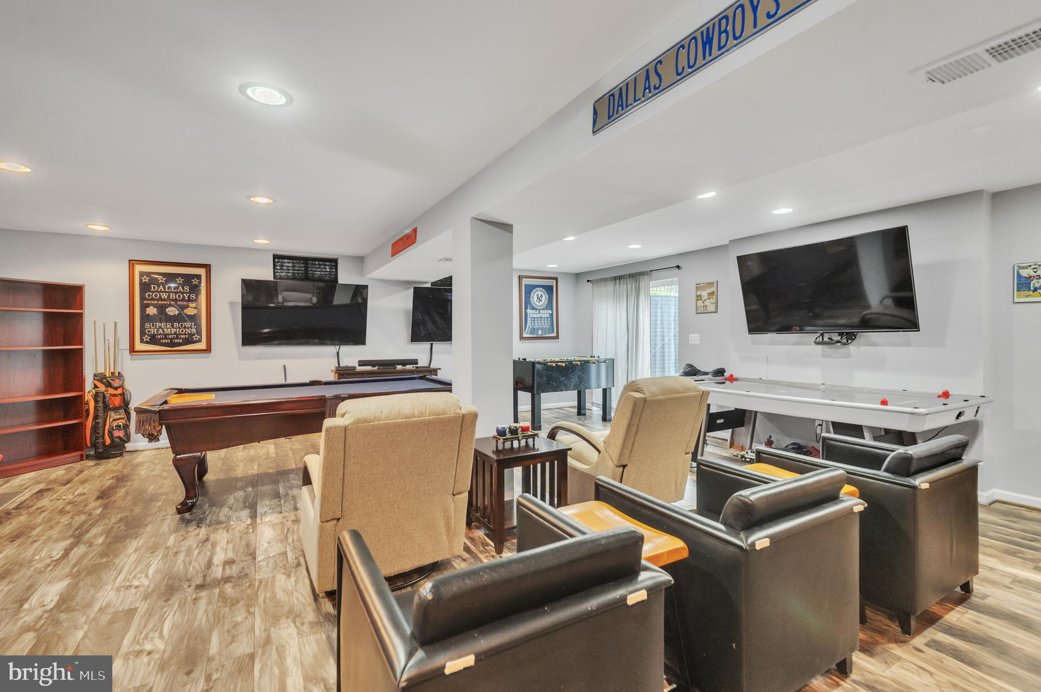 9879 Upper Mill Loop Bristow, VA 20136 - Photo 26 of 32 25x25 Rec rm w/ wood laminate flr, rec lighting