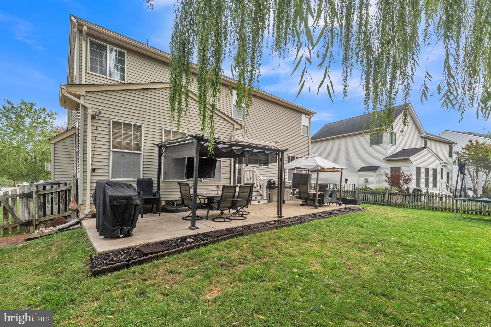 9879 Upper Mill Loop Bristow, VA 20136 - Photo 30 of 32 36x10 Patio for entertaining! Pergolas can convey
