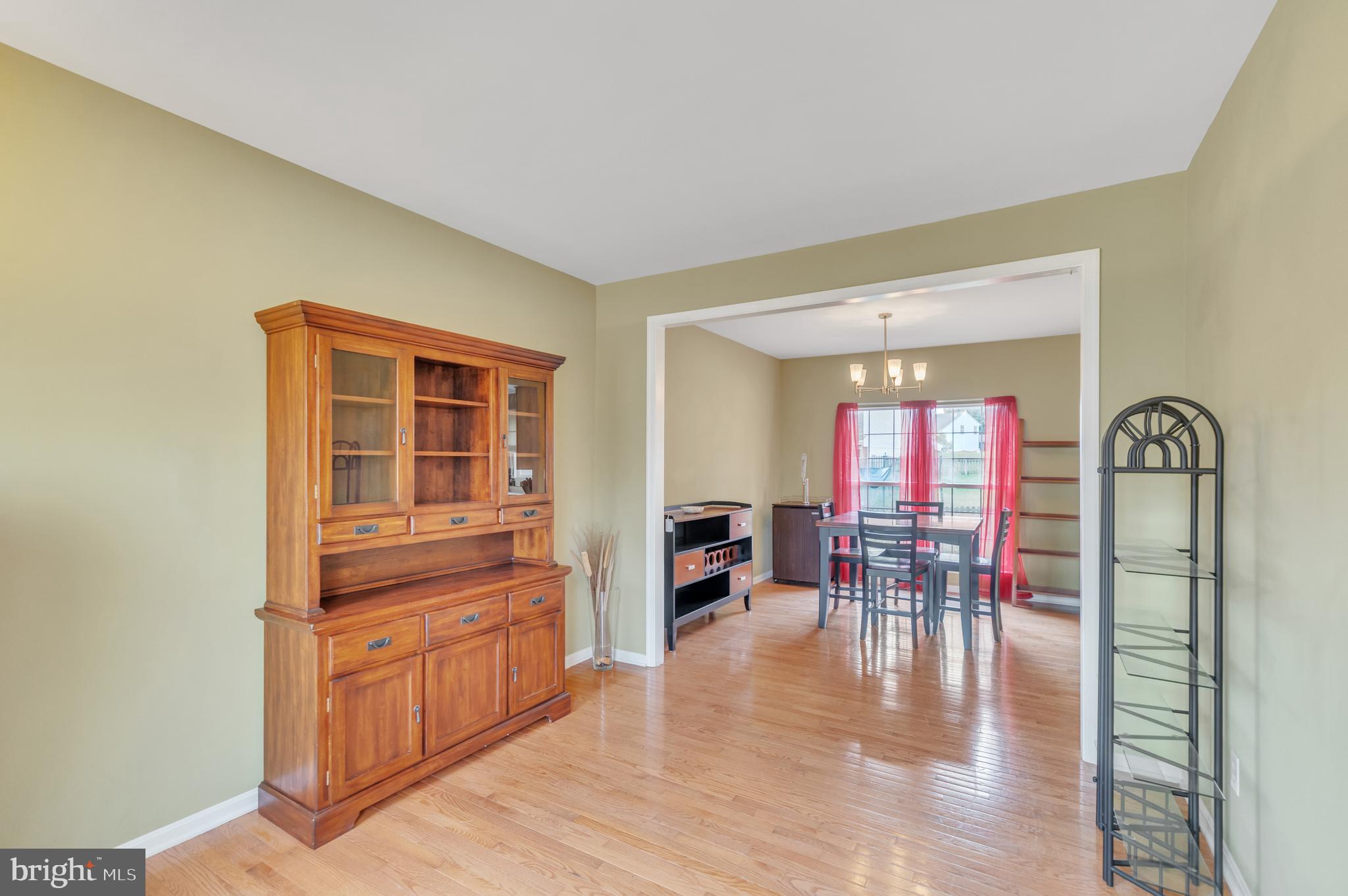 9879 Upper Mill Loop Bristow, VA 20136 - Photo 7 of 32 13x13-Living room w/ hardwood floors