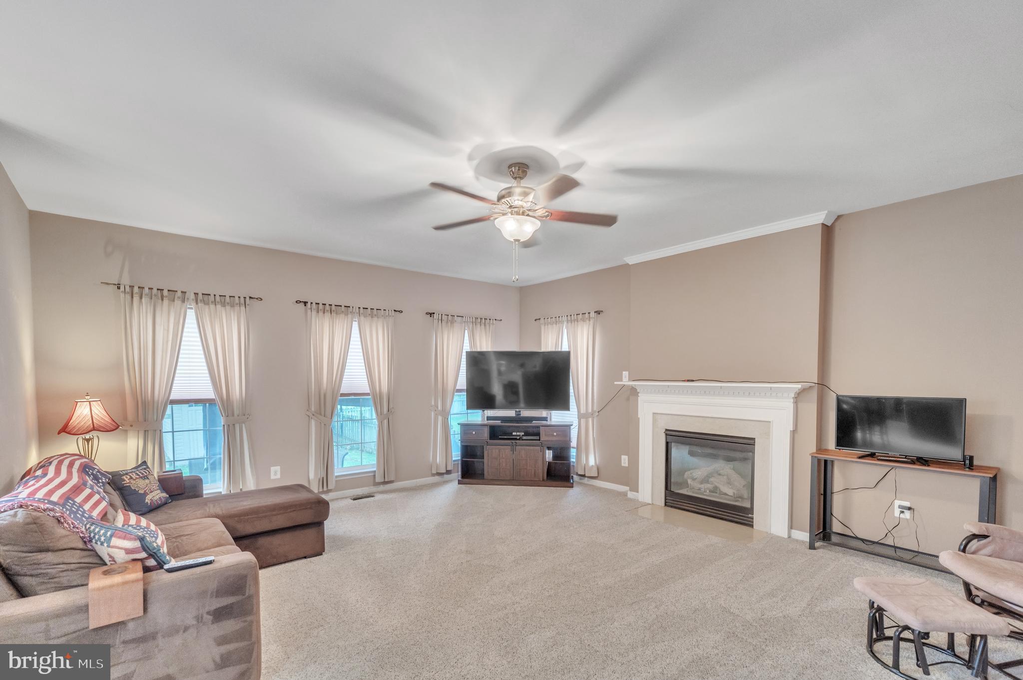 9879 Upper Mill Loop Bristow, VA 20136 - Photo 9 of 32 20x17 Family rm w/ gas log fireplace & wood mantle