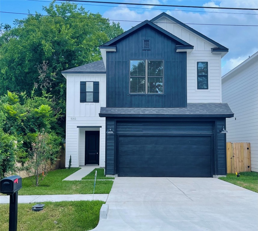 5312 Denmark Street Houston, TX 77028 - Photo 1 of 16 a front view of a house with a yard and garage