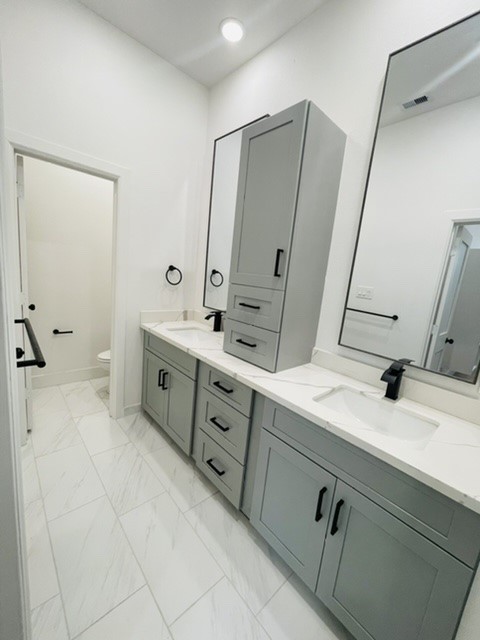 5312 Denmark Street Houston, TX 77028 - Photo 14 of 16 a bathroom with a double vanity sink mirror and