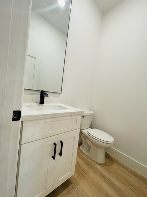 5312 Denmark Street Houston, TX 77028 - Photo 6 of 16 a bathroom with a toilet sink and mirror
