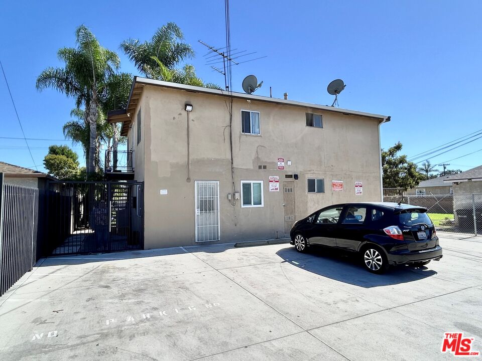 1041 Gulf Avenue Wilmington, CA 90744 - Photo 11 of 12 a view of a car parked in front of a house