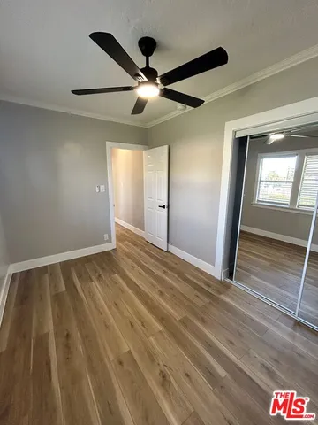 a view of an empty room and wooden floor