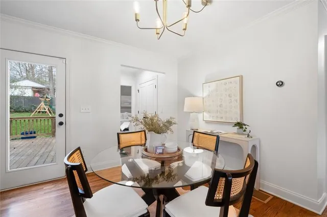 a view of a dining room with furniture and wooden floor