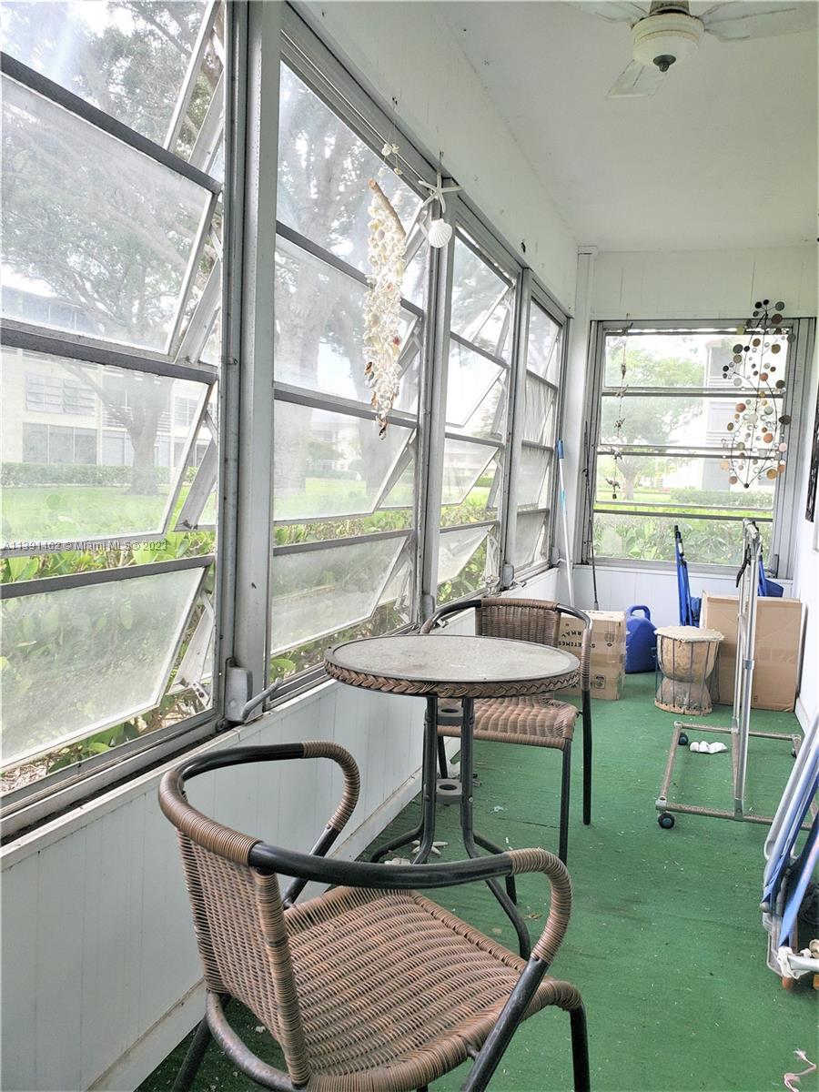 550 Mansfield M, Unit 550 Boca Raton, FL 33434 - Photo 11 of 14 a view of a workspace with furniture and a window