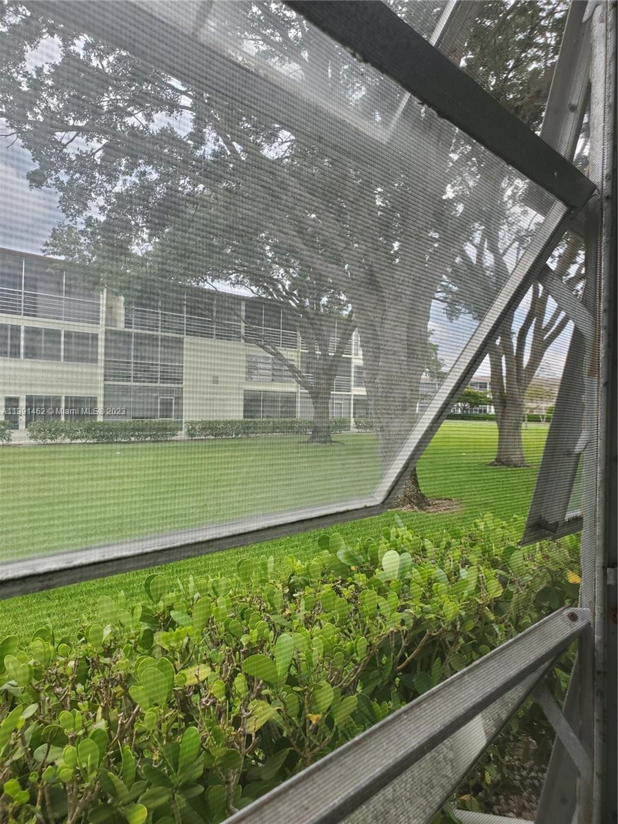 550 Mansfield M, Unit 550 Boca Raton, FL 33434 - Photo 13 of 14 a view of a garden from a balcony