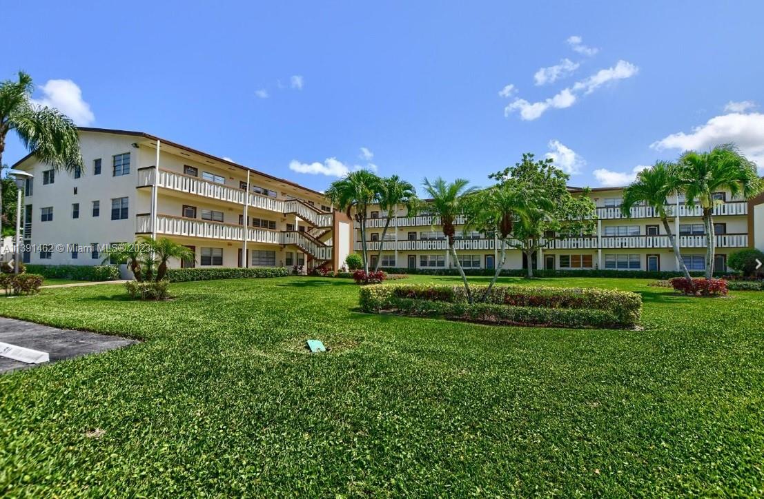 550 Mansfield M, Unit 550 Boca Raton, FL 33434 - Photo 14 of 14 a view of a house with a big yard
