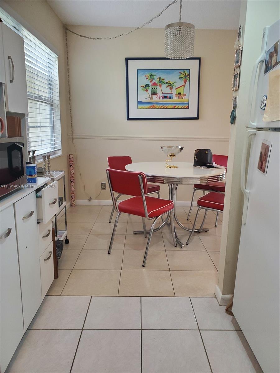 550 Mansfield M, Unit 550 Boca Raton, FL 33434 - Photo 4 of 14 a workspace with furniture and window