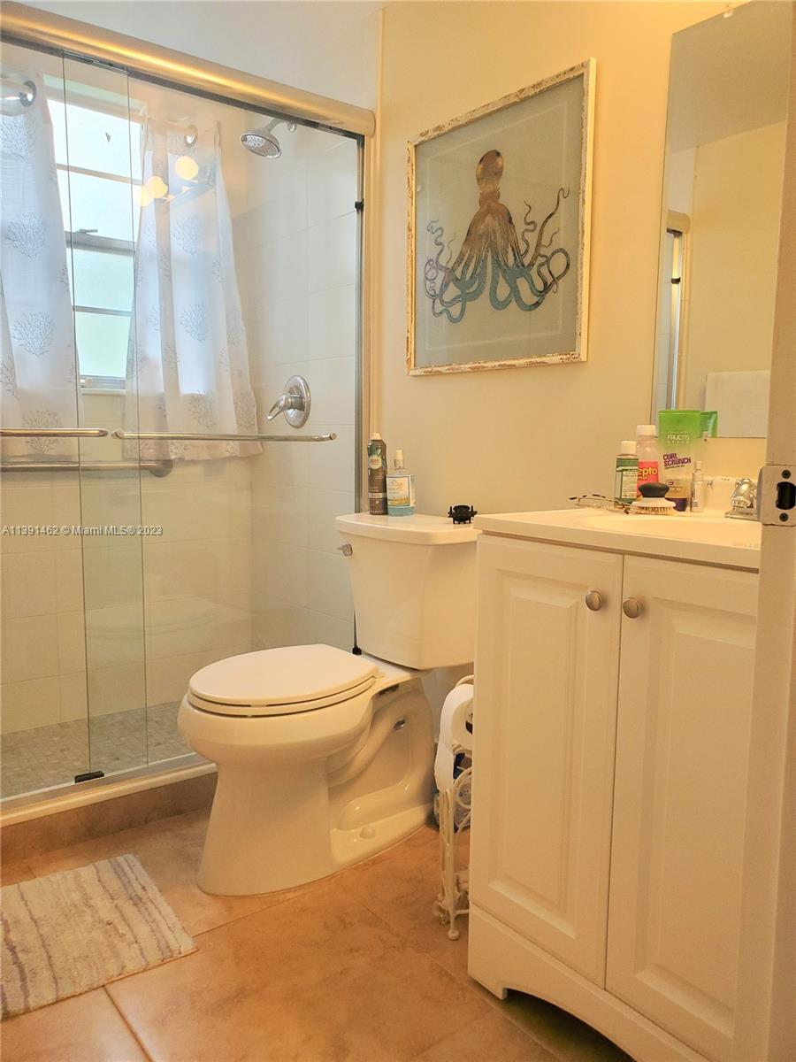 550 Mansfield M, Unit 550 Boca Raton, FL 33434 - Photo 10 of 14 a bathroom with a toilet and a shower
