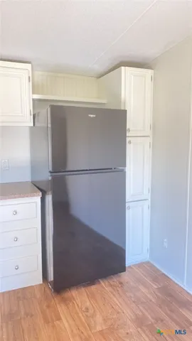 a view of a closet in kitchen