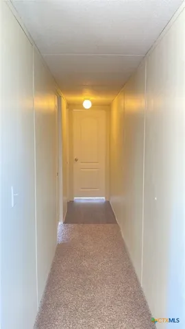 a view of hallway with shower