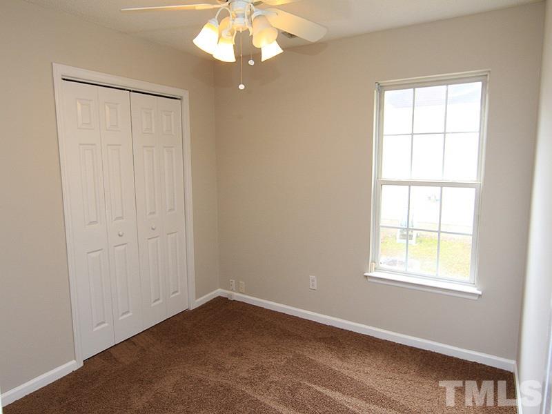 4620 Silverdene Street Raleigh, NC 27616 - Photo 8 of 12 an empty room with a window
