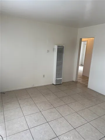 a view of an empty room and entryway