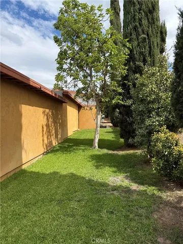 a backyard of a house with lots of green space