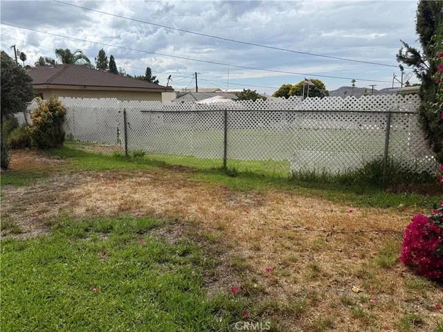 a view of a potted plant sitting in front of a house