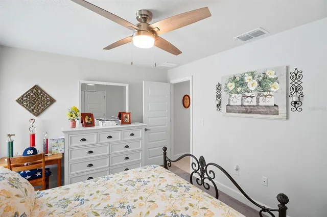 a bed room with a bed and a dresser