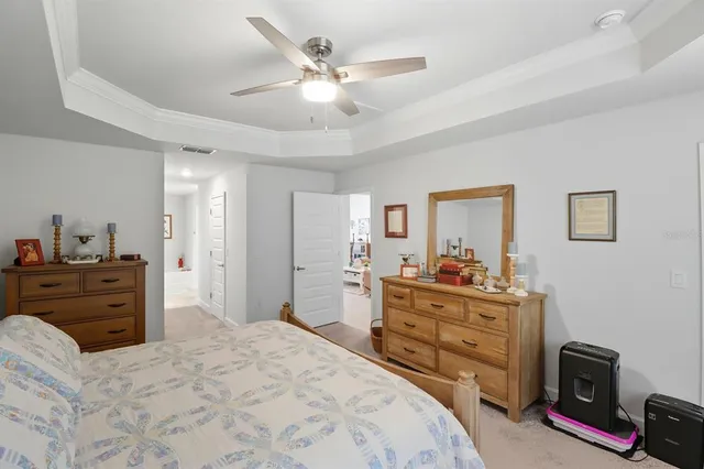 a bed room with a bed and a television